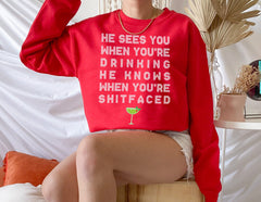red sweater with a drink that says he sees you when you're drinking he knows when you're shitfaced - HighCiti