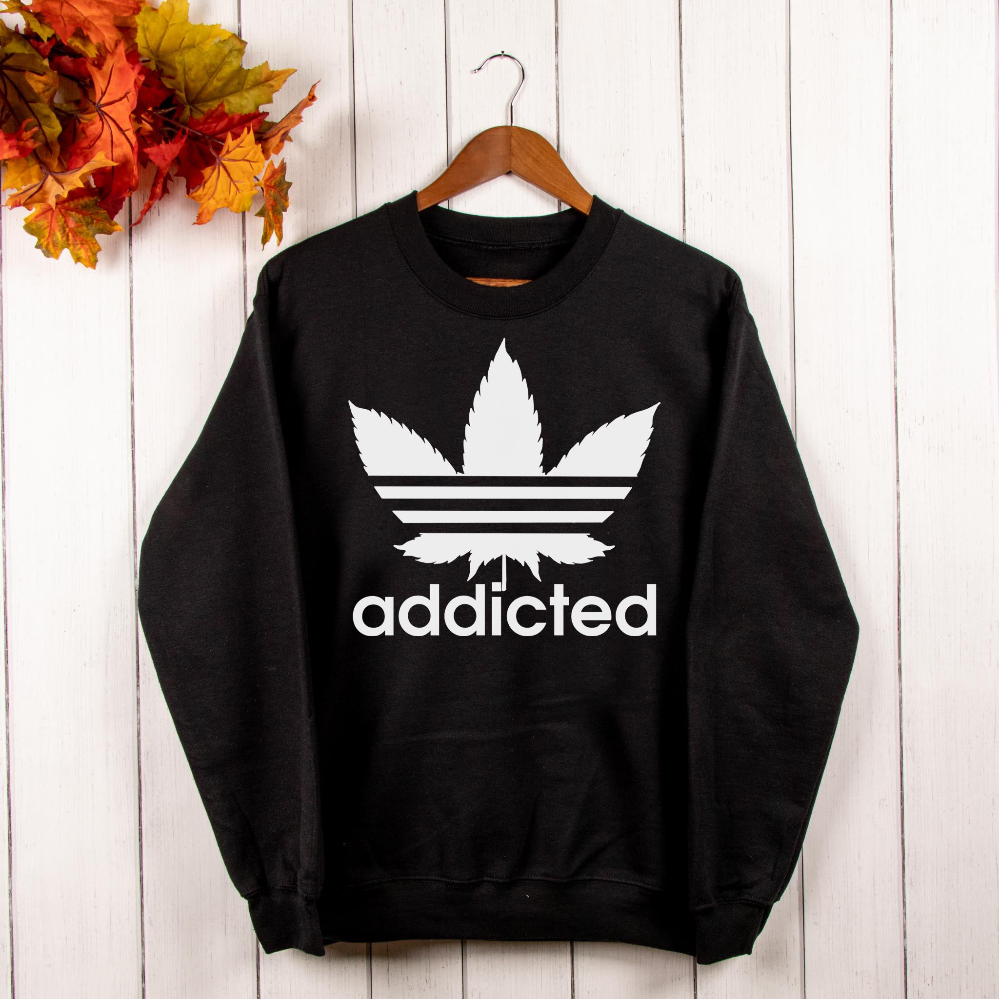 black sweater with a weed leaf saying addicted - HighCiti