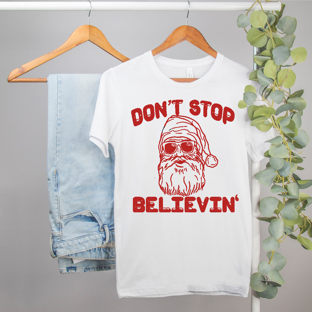 funny santa shirt that says don't stop believin - HighCiti
