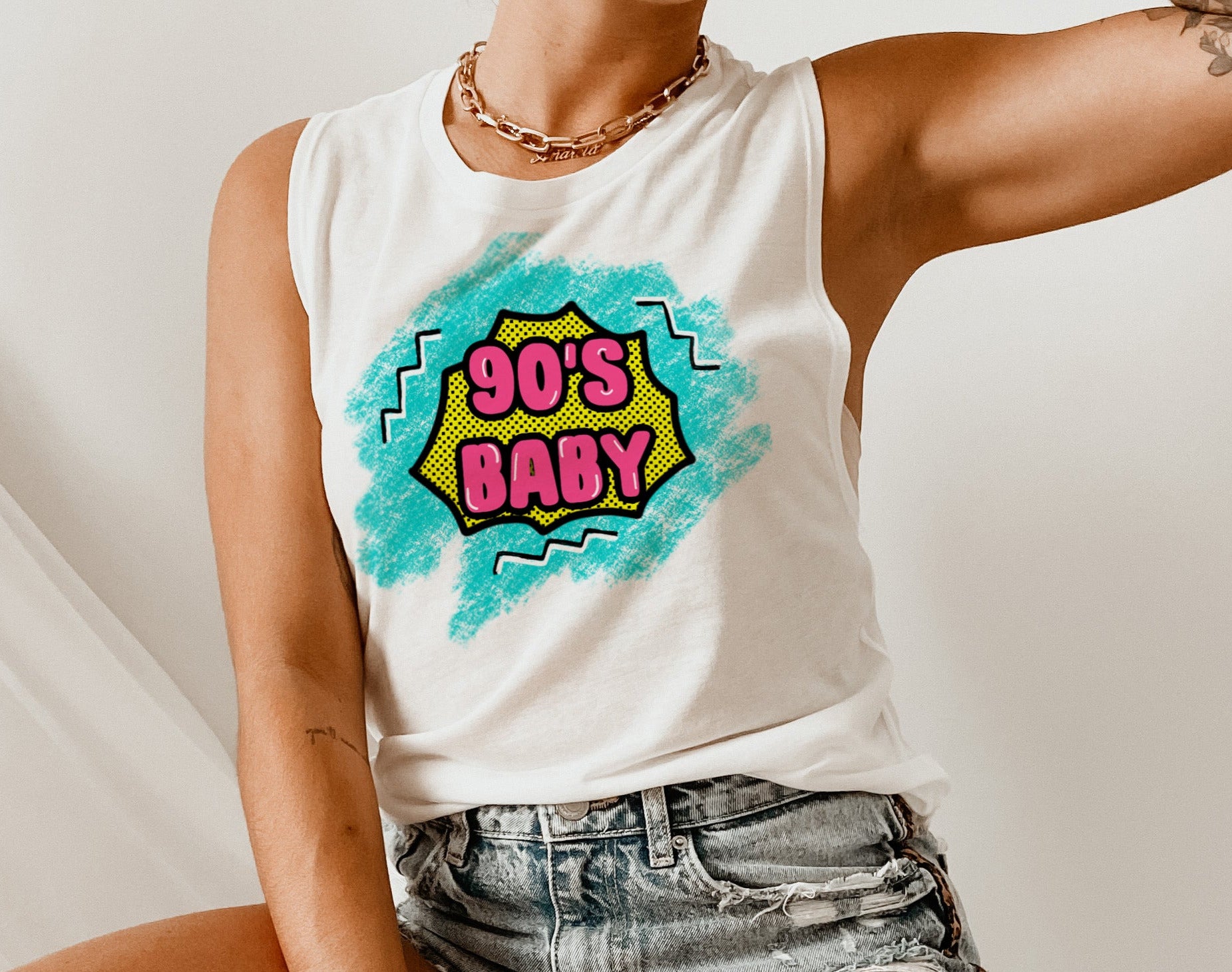white muscle tank with a retro old school graphic that says 90's baby - HighCiti