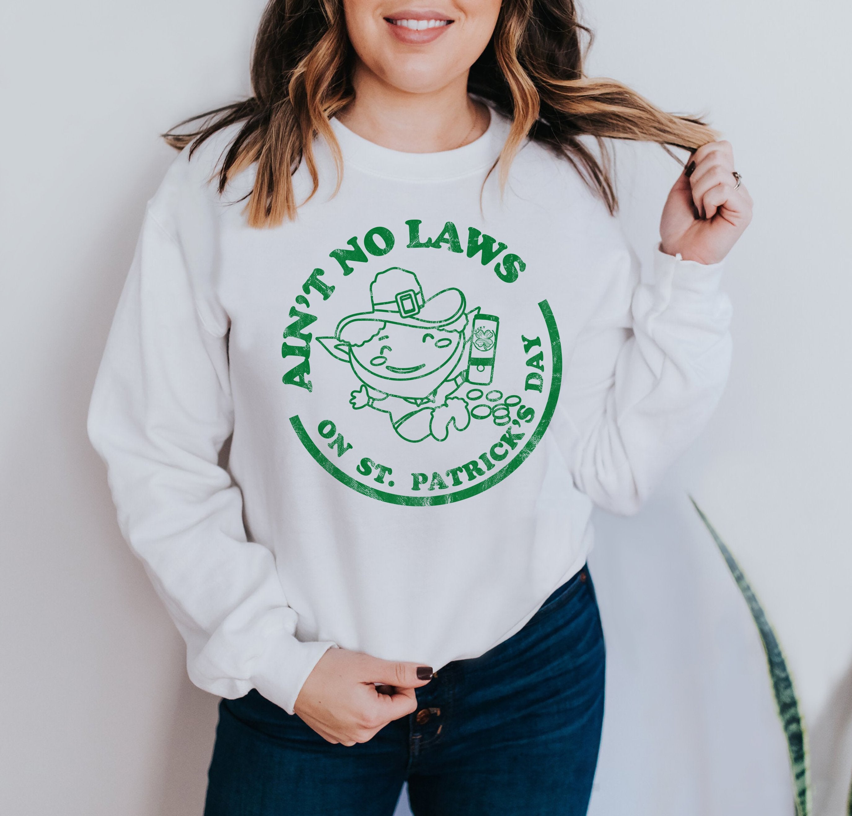 White sweatshirt with a leprechaun drinking that says ain't no laws on st patrick's day - HighCiti