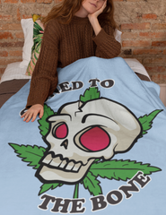 Light blue blanket with a skull and a cannabis leaf saying stoned to the bone - HighCiti