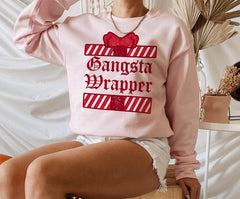 Pink sweater with a present that says gangsta wrapper - HighCiti