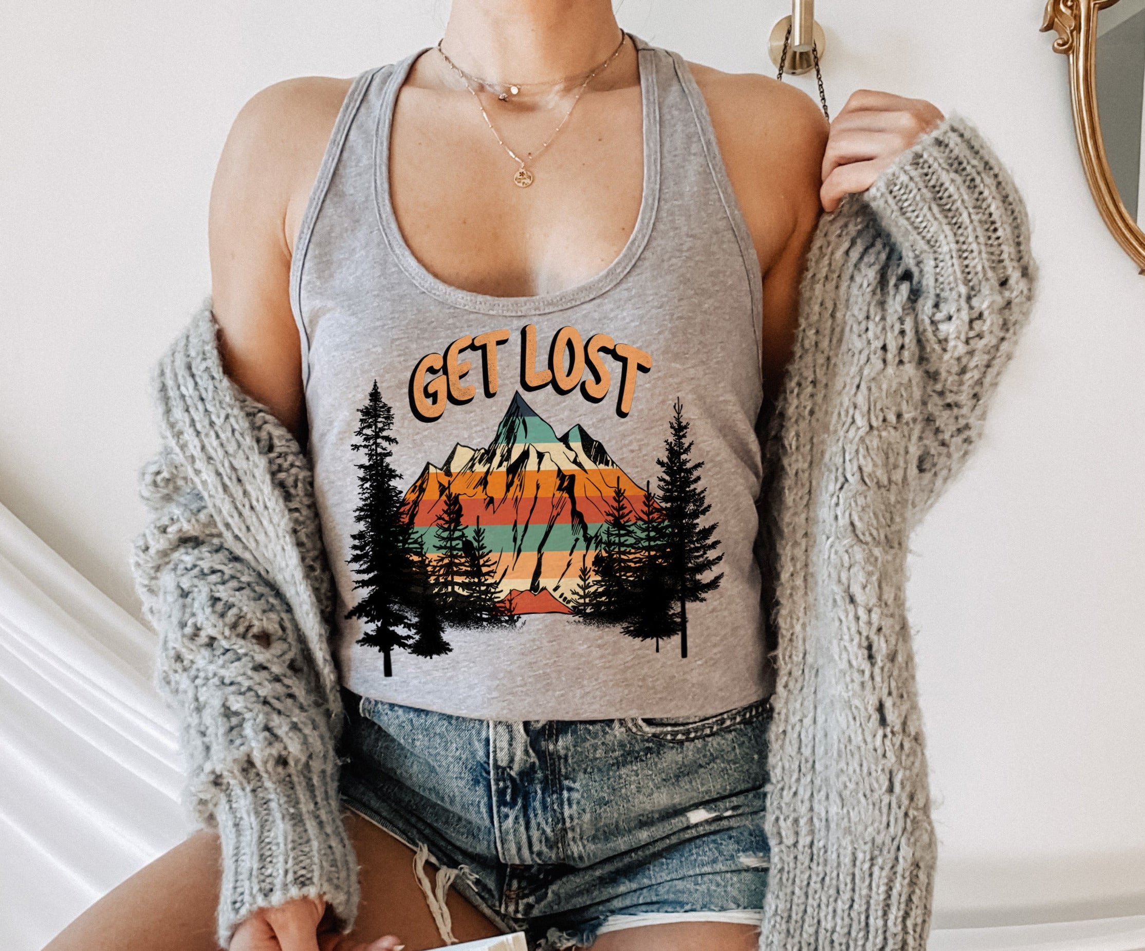 grey tank top with a mountain and a forest that says get lost - HighCiti