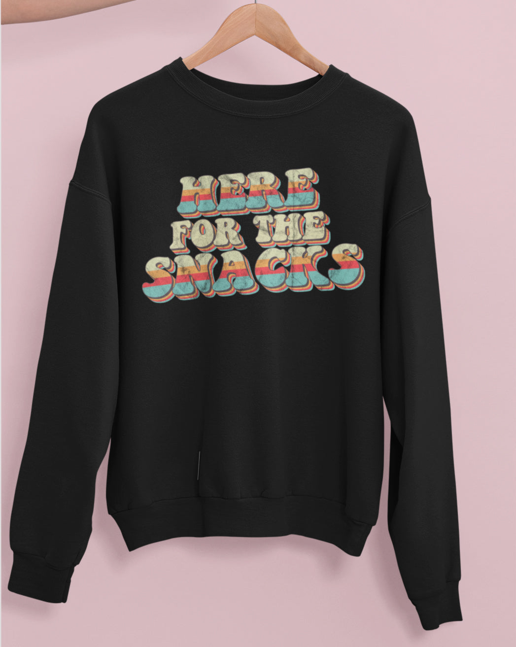 Black sweatshirt with colorful retro graphic that says here for the snacks - HighCiti