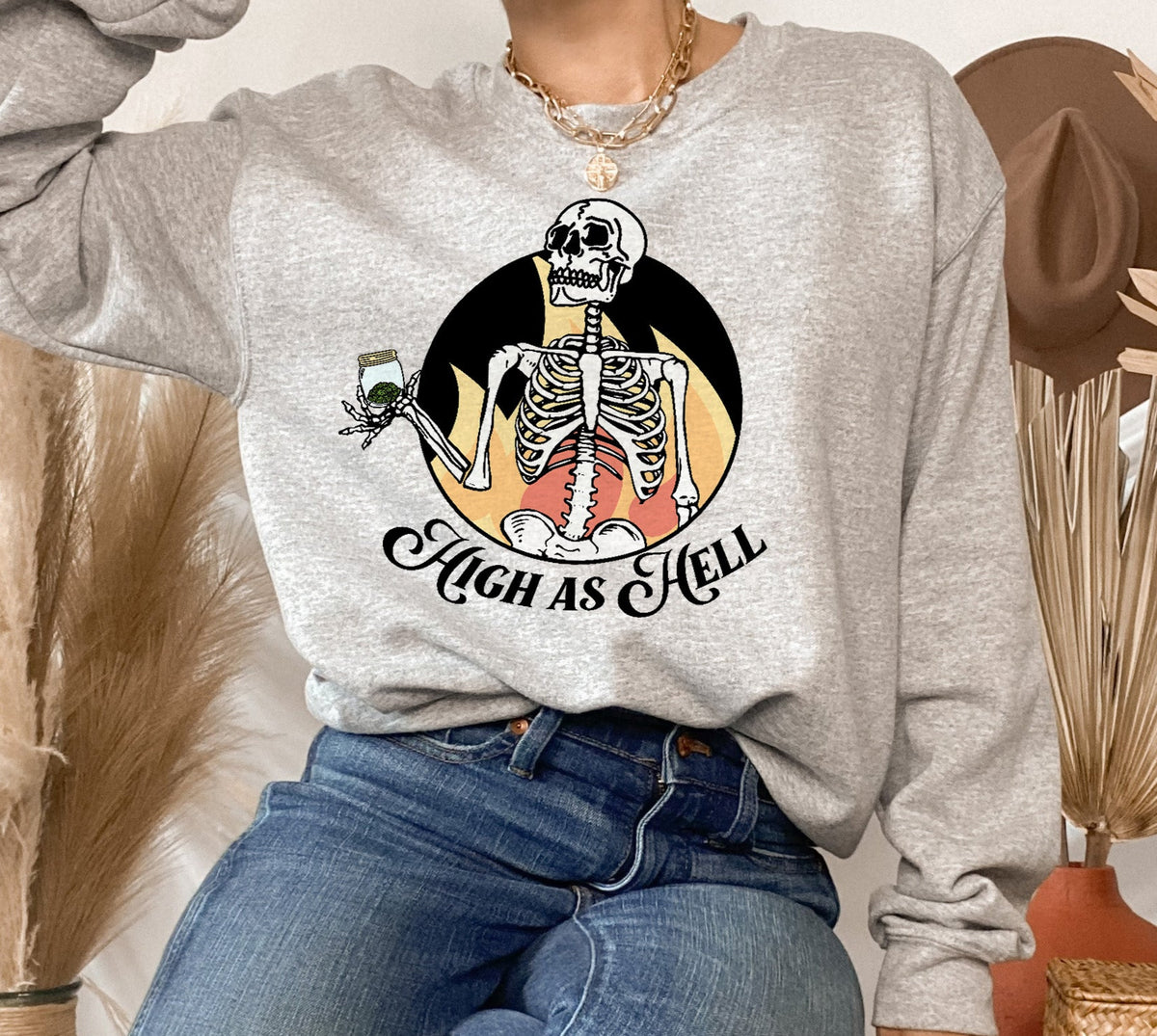 Grey sweatshirt with a skeleton holding a jar of weed that says high as hell - HighCiti