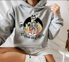 Grey hoodie with a skeleton holding a jar of weed that says high as hell - HighCiti