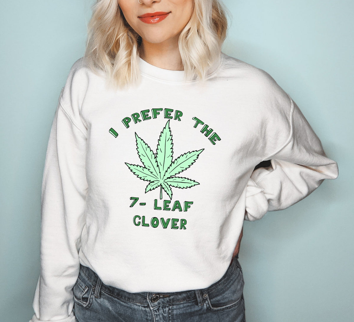 White sweatshirt with a cannabis leaf that says I prefer the 7 leaf clover - HighCiti