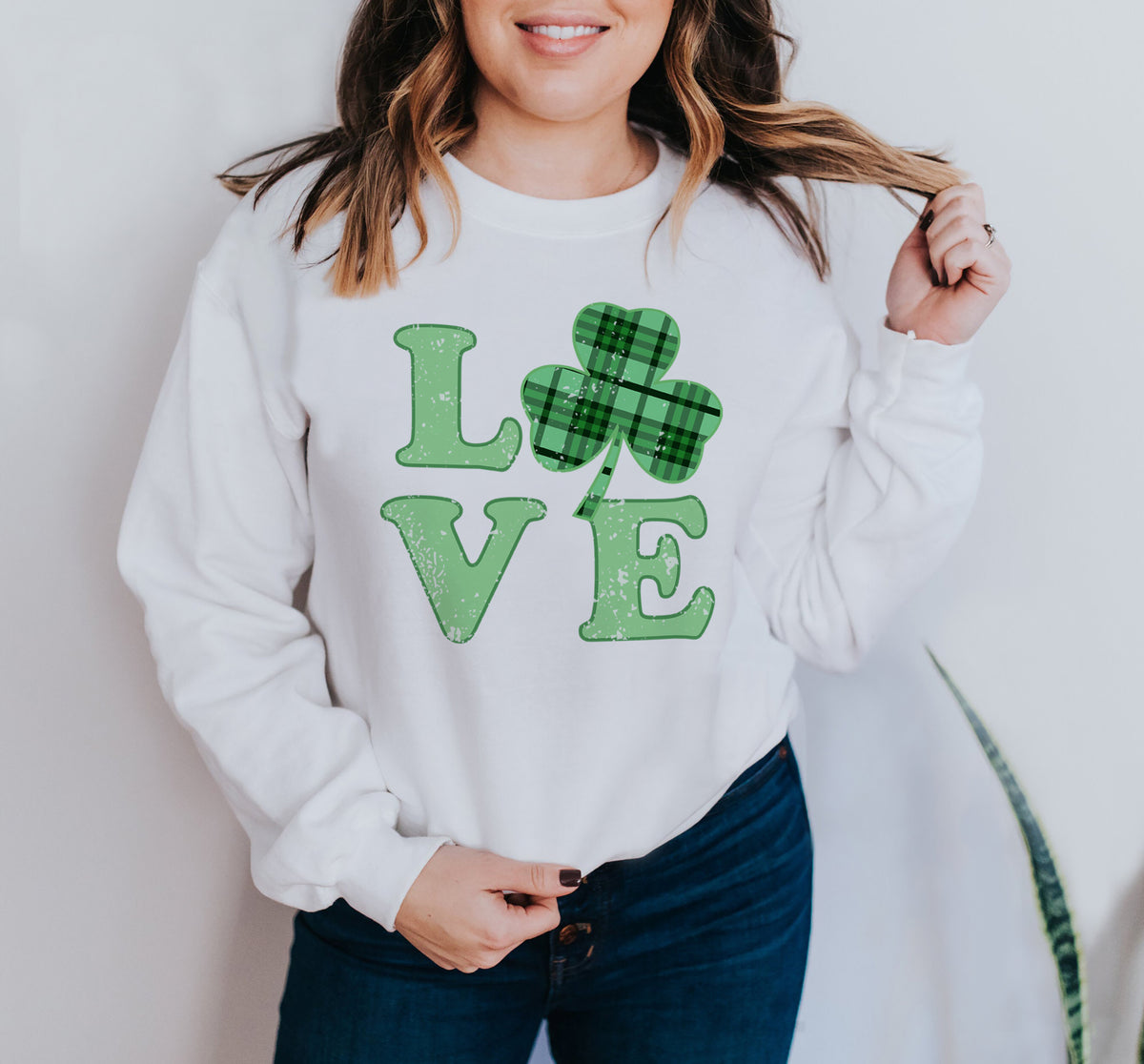 White sweatshirt with a green shamrock plaid that says love - HighCiti