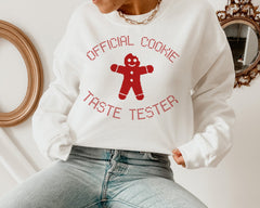 white sweater with a gingerbread that says official cookie taste tester - HighCiti