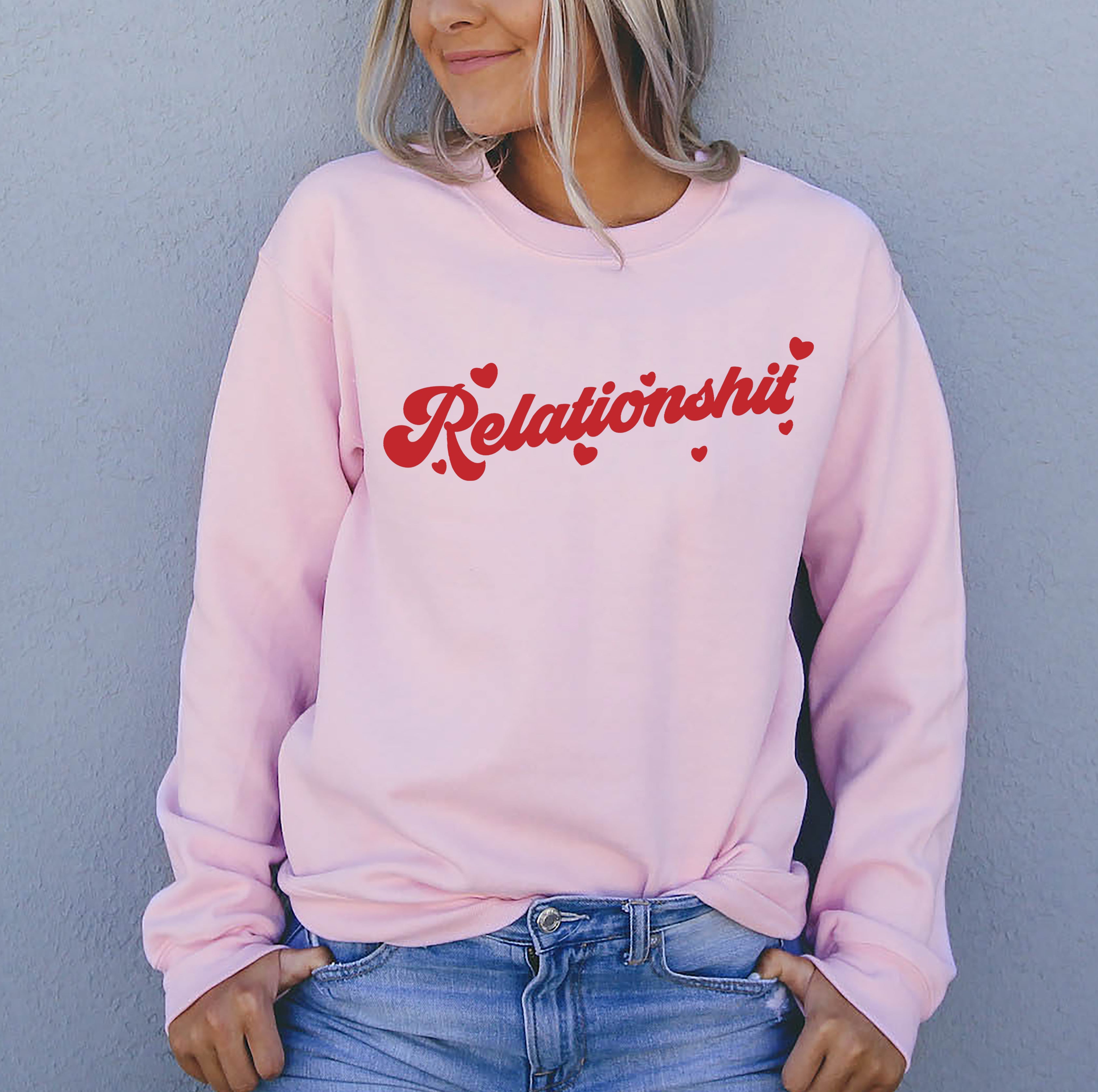 Pink sweatshirt with red hearts saying relationshit - HighCiti