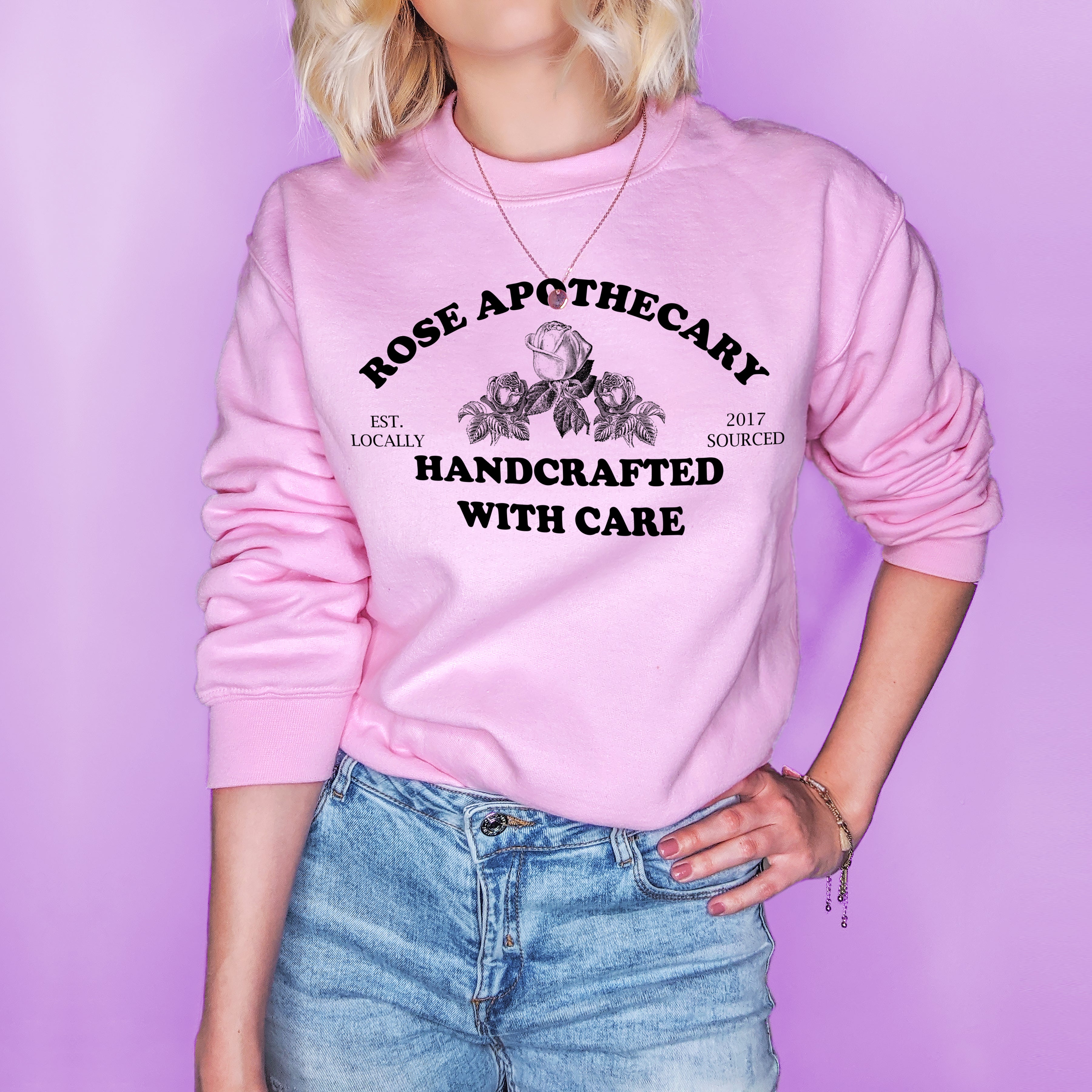 Pink sweatshirt with roses that says rose apothecary handcrafted with care - HighCiti