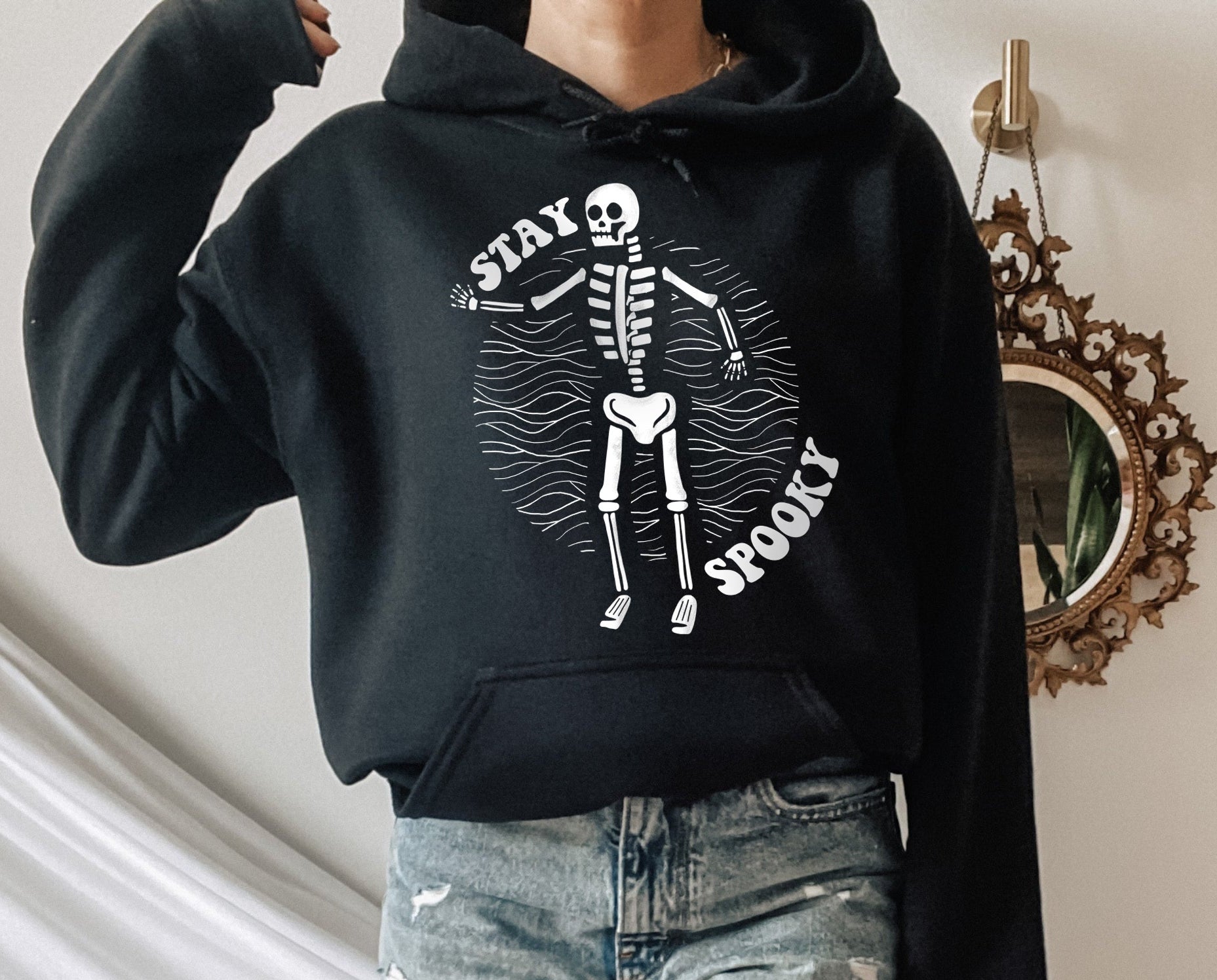 black hoodie with a skeleton that says stay spooky - HighCiti