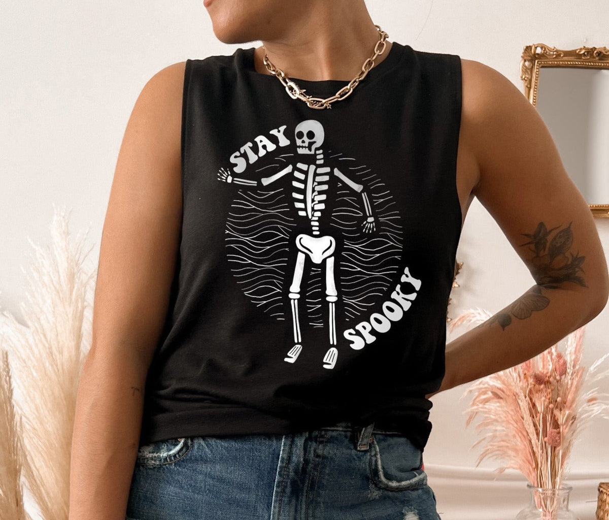 black muscle tank with a skeleton that says stay spooky - HighCiti