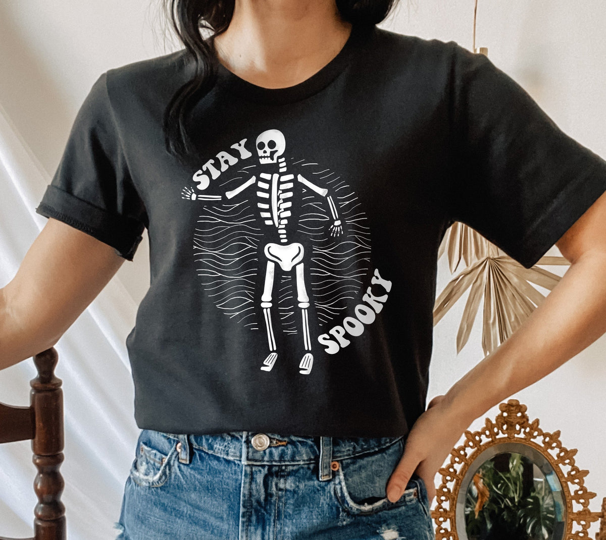 black shirt with a skeleton that says stay spooky - HighCiti
