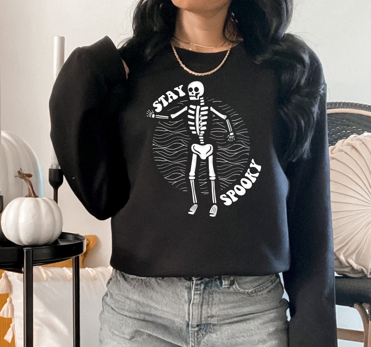 black sweater with a skeleton that says stay spooky - HighCiti