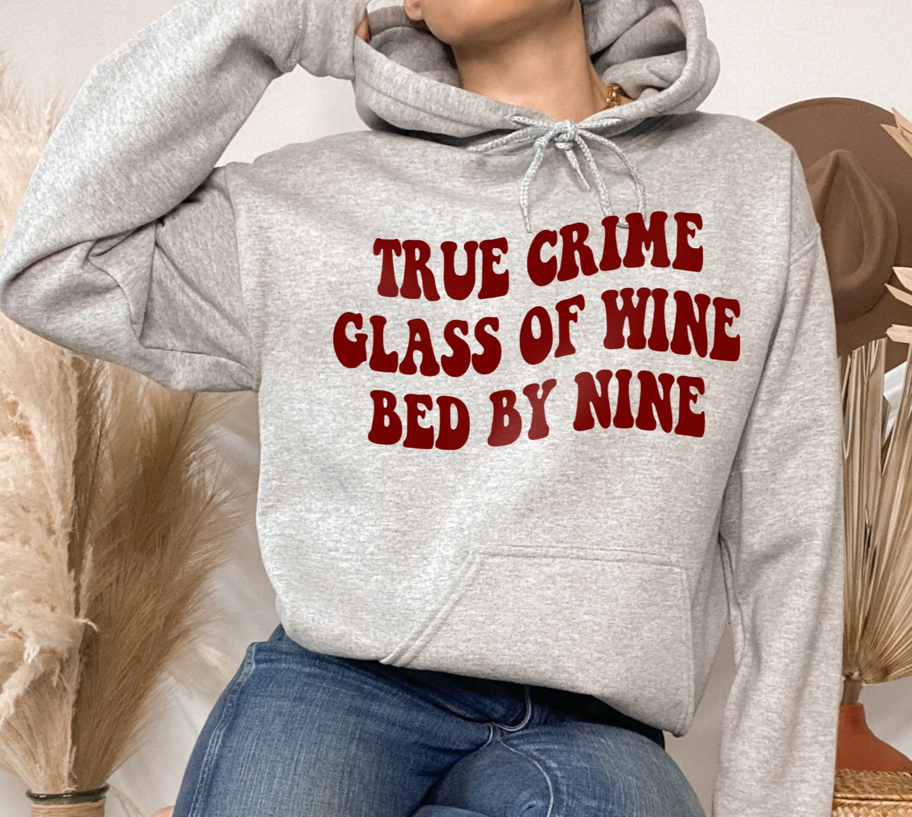 Grey hoodie that says true crime glass of wine bed by nine - HighCiti