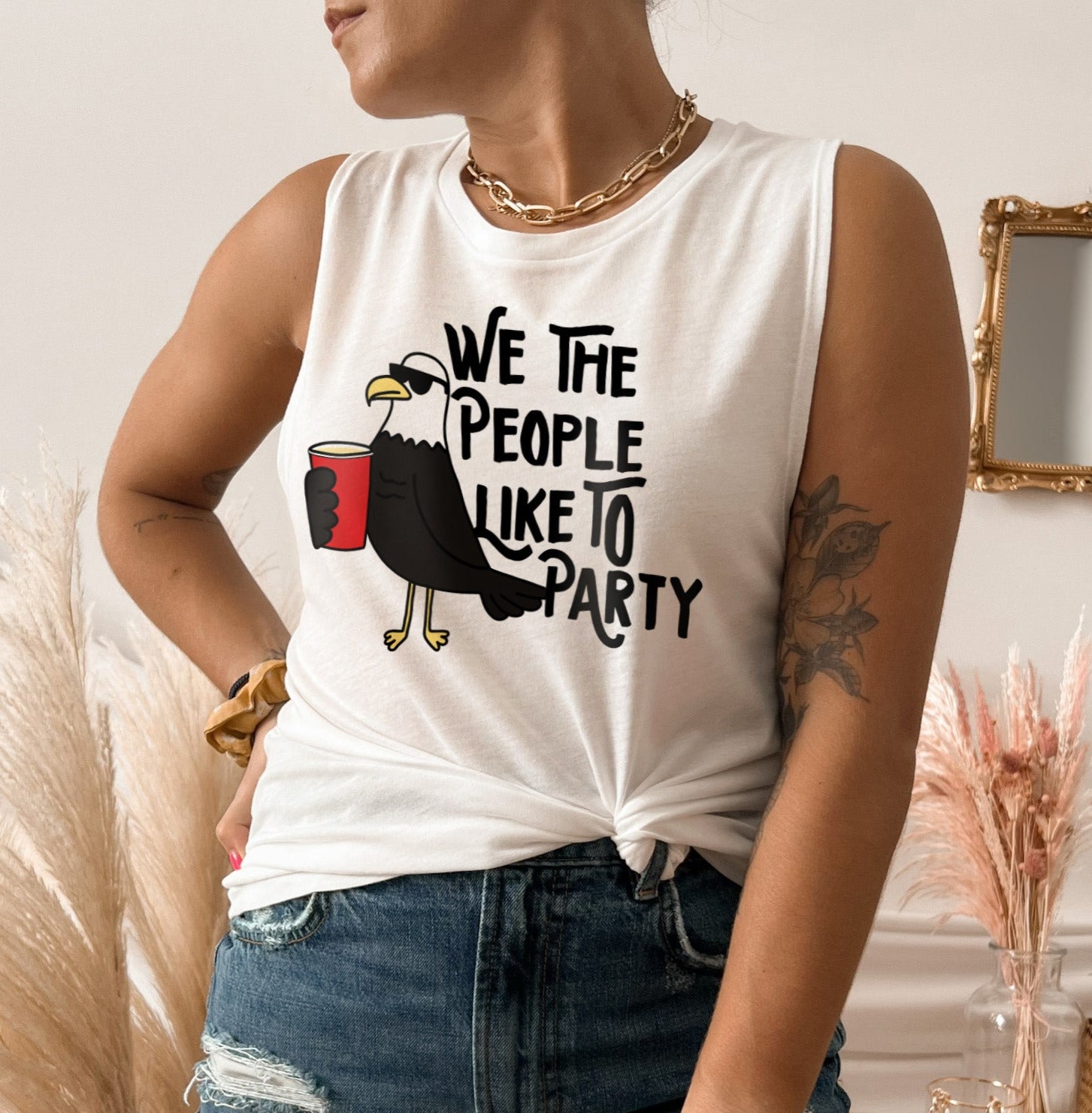 white muscle tank with a bird that says we the people like to party - HighCiti