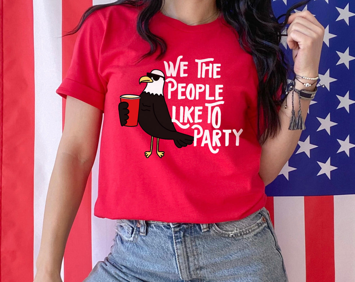 red shirt with a birsd that says we the people like to party - HighCiti